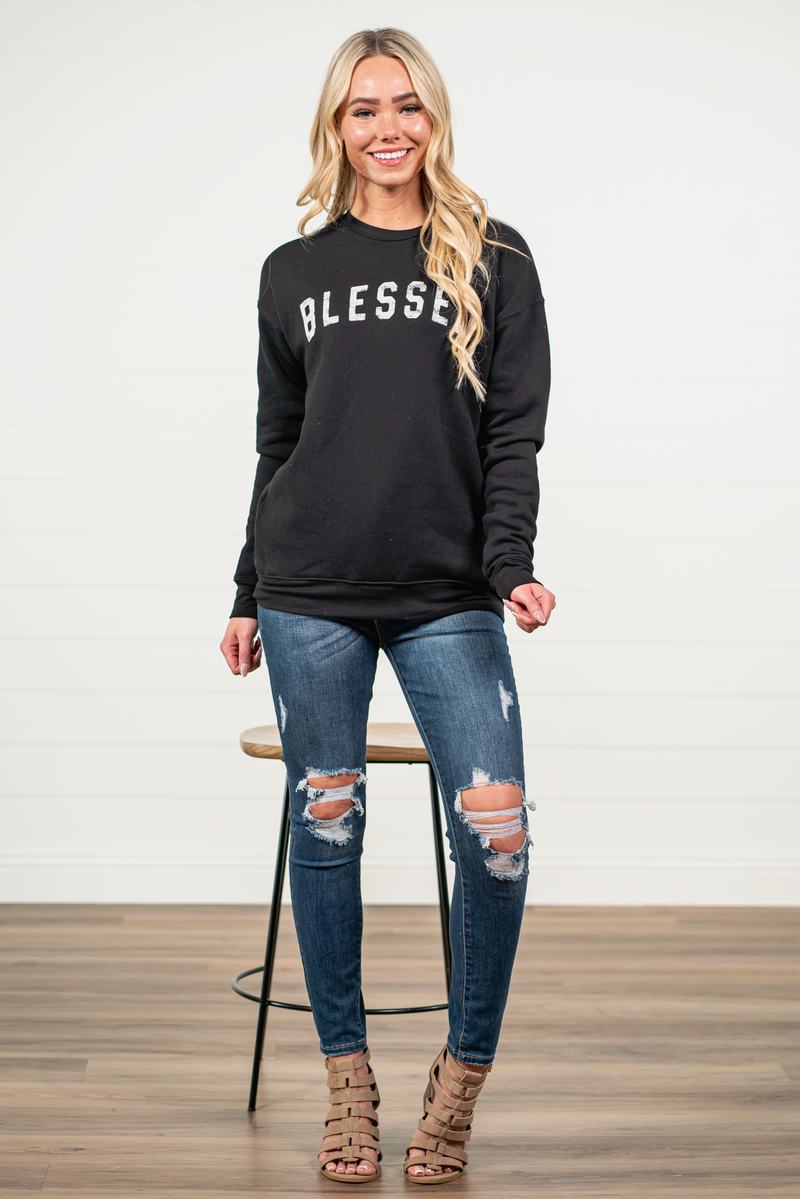Blessed by Oat Collective   Graphic Fleece Pullover Sweater  Color: Black Neckline: Round  Sleeve: Long Sleeve Spun from plush sponge fleece fabric Ribbed Cuffed Wrist Bands Oversized Pull Over Style #: OT2112L711 Contact us for any additional measurements or sizing.    