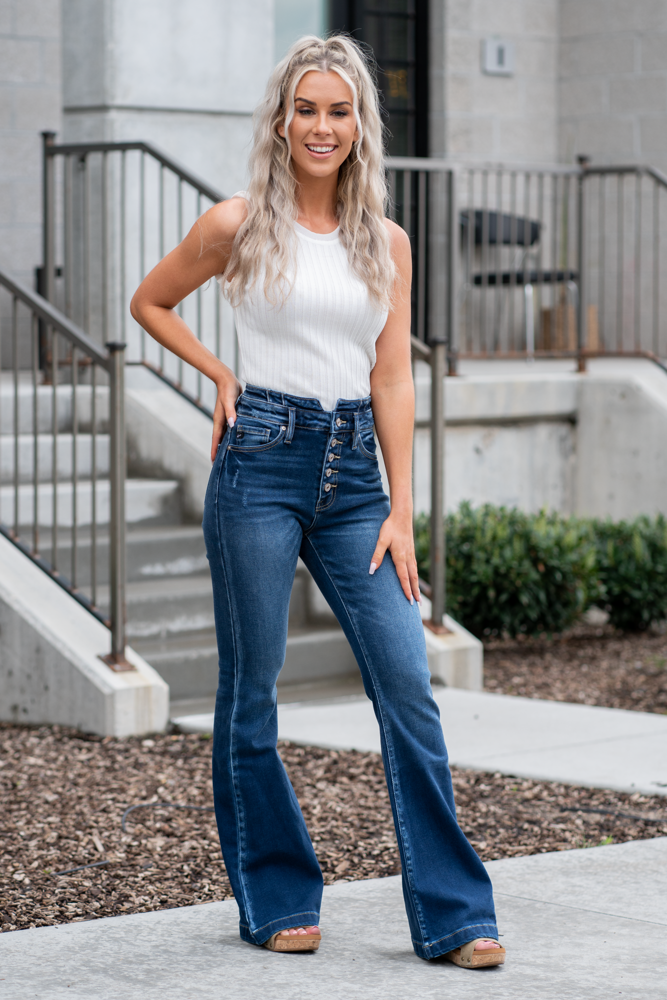 KanCan Jeans   KanCan Stretch Level: Comfort Stretch  Curvy Fit Flare   Color: Dark Blue Wash Cut: Flare, 33" Inseam  Rise: High Rise, 11" Front Rise 95% COTTON, 4% POLYESTER, 1% LYCRA Fly: Exposed Button Fly Style #: KC8602D-CV Contact us for any additional measurements or sizing.  *Measured on the smallest size, measurements may vary by size. 