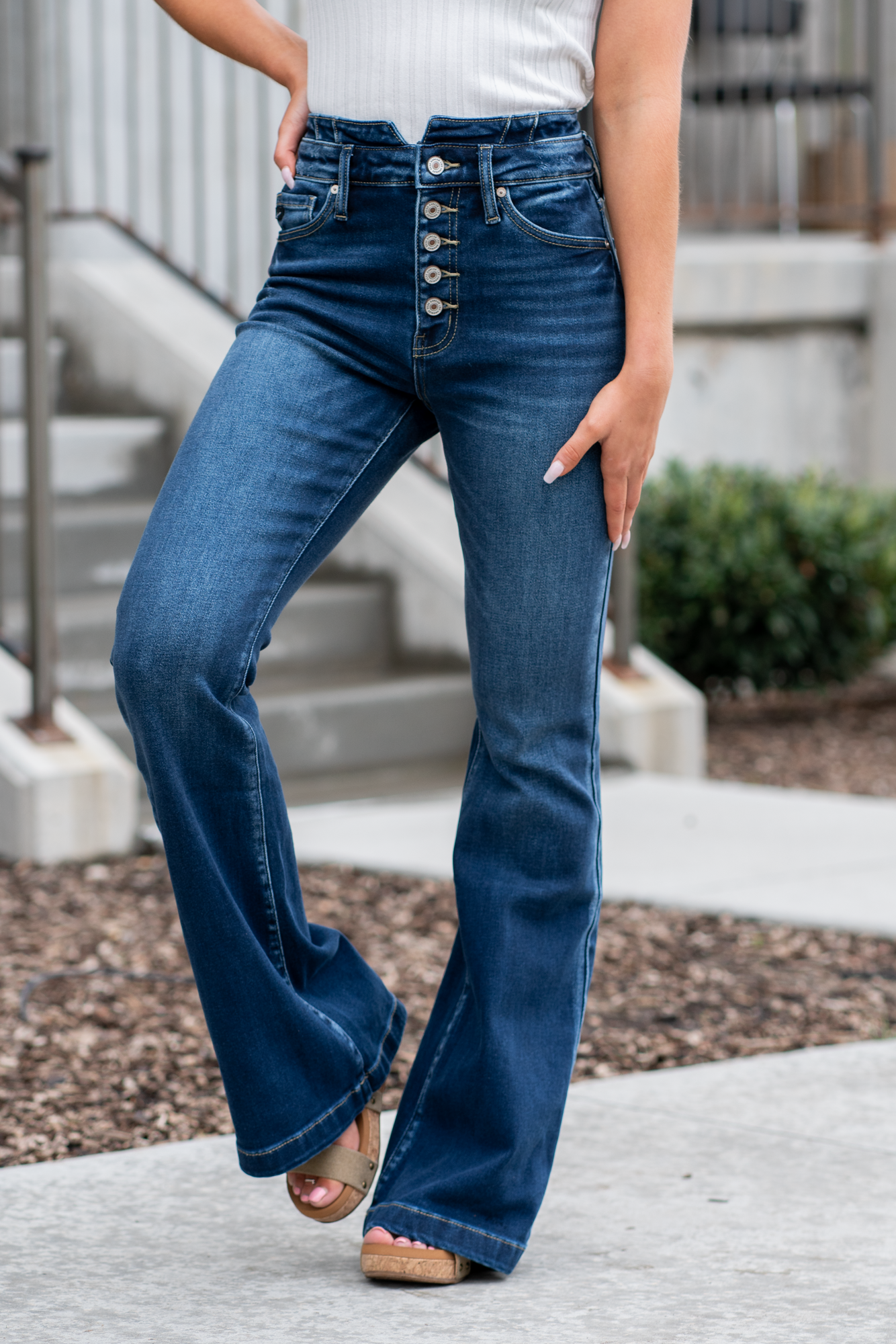 KanCan Jeans   KanCan Stretch Level: Comfort Stretch  Curvy Fit Flare   Color: Dark Blue Wash Cut: Flare, 33" Inseam  Rise: High Rise, 11" Front Rise 95% COTTON, 4% POLYESTER, 1% LYCRA Fly: Exposed Button Fly Style #: KC8602D-CV Contact us for any additional measurements or sizing.  *Measured on the smallest size, measurements may vary by size. 