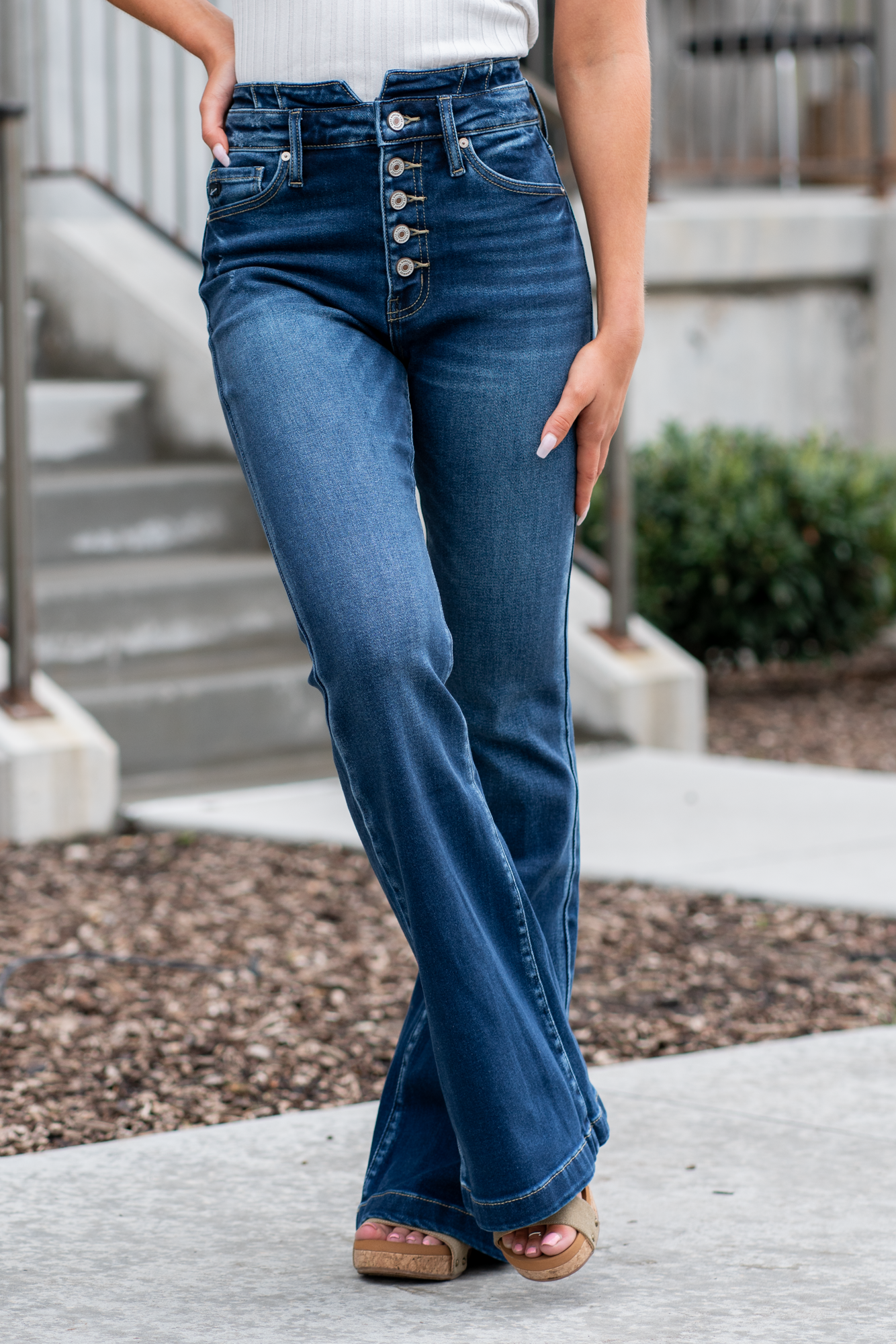 KanCan Jeans   KanCan Stretch Level: Comfort Stretch  Curvy Fit Flare   Color: Dark Blue Wash Cut: Flare, 33" Inseam  Rise: High Rise, 11" Front Rise 95% COTTON, 4% POLYESTER, 1% LYCRA Fly: Exposed Button Fly Style #: KC8602D-CV Contact us for any additional measurements or sizing.  *Measured on the smallest size, measurements may vary by size. 