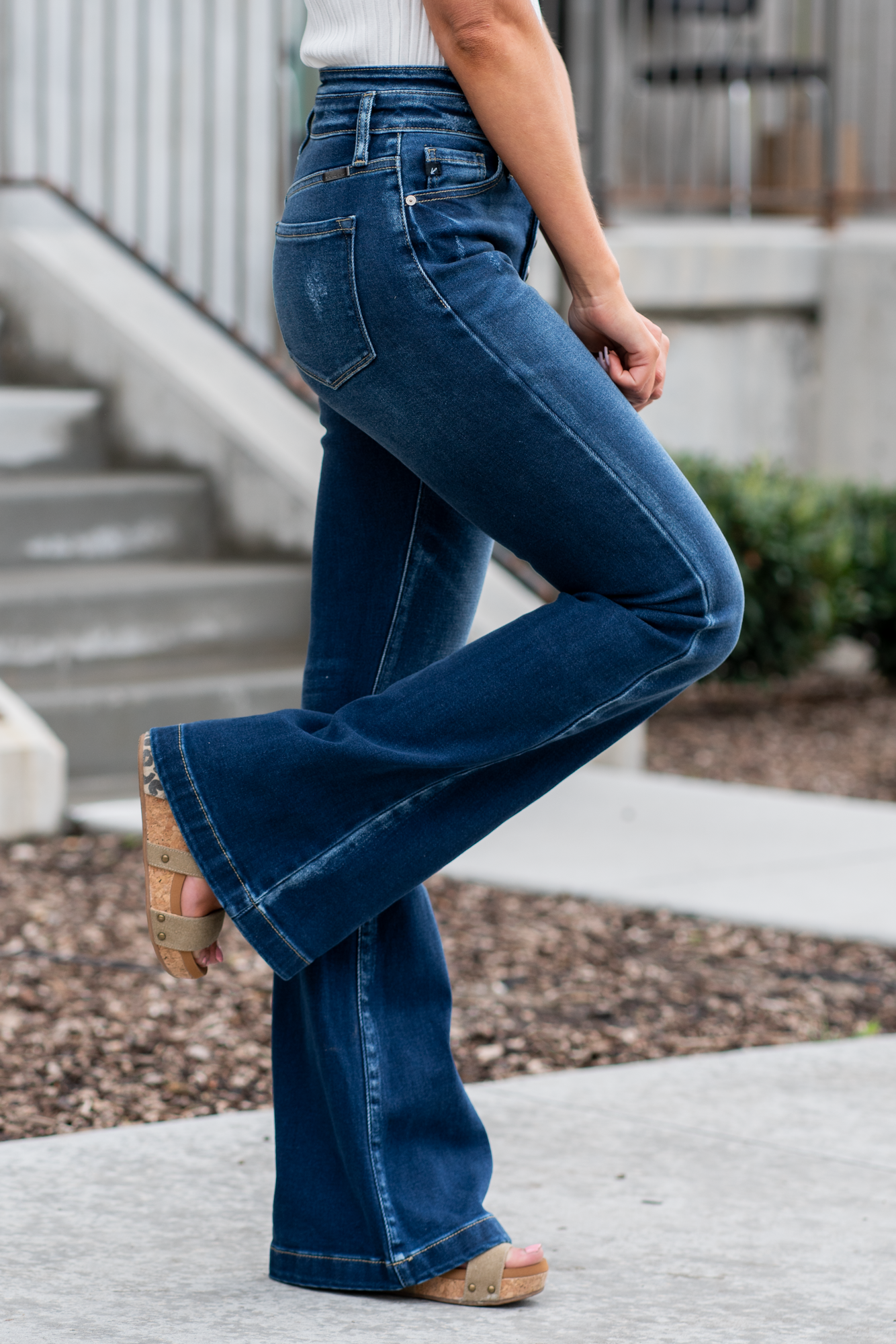 KanCan Jeans   KanCan Stretch Level: Comfort Stretch  Curvy Fit Flare   Color: Dark Blue Wash Cut: Flare, 33" Inseam  Rise: High Rise, 11" Front Rise 95% COTTON, 4% POLYESTER, 1% LYCRA Fly: Exposed Button Fly Style #: KC8602D-CV Contact us for any additional measurements or sizing.  *Measured on the smallest size, measurements may vary by size. 