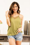 Pair this silky camisole under your favorite cardis or dusters.  Collection: Spring 2021 Color: Vintage Olive Neckline: V Neck Lace Material: 96% Polyester 4% Spandex Style #: IP0065-Olive Contact us for any additional measurements or sizing.   Taylor wears a size 3 in jeans, a small top, and 8.5 in shoes. She is wearing a size small in this top.