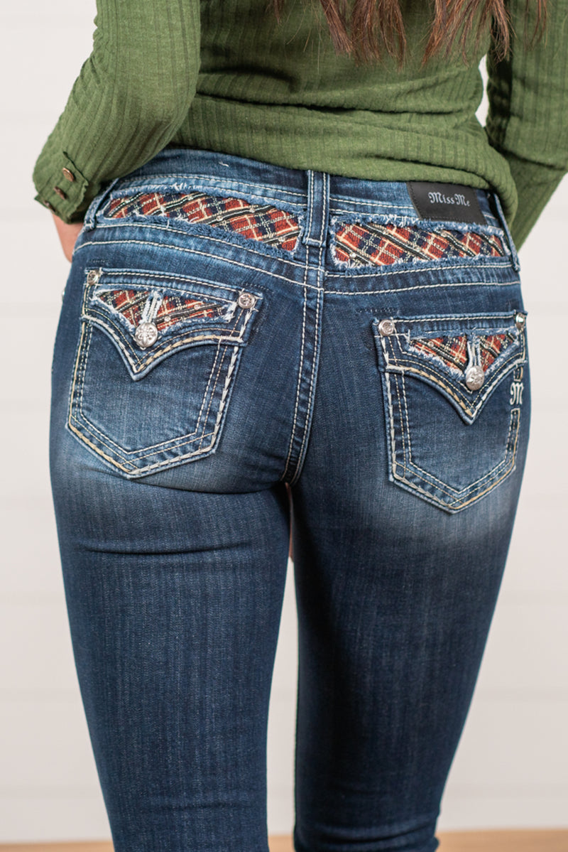 Miss Me  Wear these Christmas plaid pocket jeans every day to bling up your wardrobe. Boot cut jeans featuring a 5 pocket design, whiskering, and crystal rivets. Wash: Dark Blue Inseam: 34" Boot Cut* Mid Rise, 8.75" Front Rise* Silver Buttons and Rivets  Style #: M3817B4    Contact us for any additional measurements or sizing.    *Measured on the smallest size, measurements may vary by size.