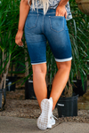 KanCan Jeans  These ultra-soft bermuda shorts are so comfortable they will be the only shorts you will want to wear! Pair with a tee and flip-flops for an easy-going outfit for sunny days.  Collection: Core Style Color: Dark Wash Cut: Bermudas, 11" Inseam Rise: Mid-Rise, 8.5" Front Rise Material: 70% COTTON 8% POLYESTER 2% SPANDEX Stitching: Classic Fly: Zip  Style #: KC5020D Contact us for any additional measurements or sizing.    *Measured on the smallest size, measurements may vary by