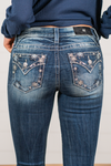 Miss Me  Wear these snowflake embellished pocket jeans every day to bling up your wardrobe. Boot cut jeans featuring a 5 pocket design, whiskering, and crystal rivets. Wash: Dark Blue Inseam: 34" Boot Cut* Mid Rise, 8.75" Front Rise* Silver Buttons and Rivets  Style #: M3823B Contact us for any additional measurements or sizing.    *Measured on the smallest size, measurements may vary by size.   