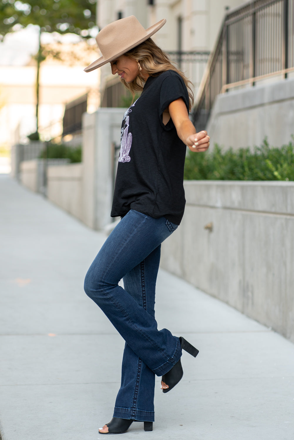 Zutter  This top spoke to you, now tell everyone else. You are a cowgirl at heart.  Collection: Fall 2020 Color: Black Neckline: Round Sleeve: Short Material: 50% Modal 50% Cotton Style #: F425-0139 Contact us for any additional measurements or sizing.  Taylor is 5'7" and wears a size 3 in jeans, small top and an 8.5 in shoes. She is wearing a size small in this tee.