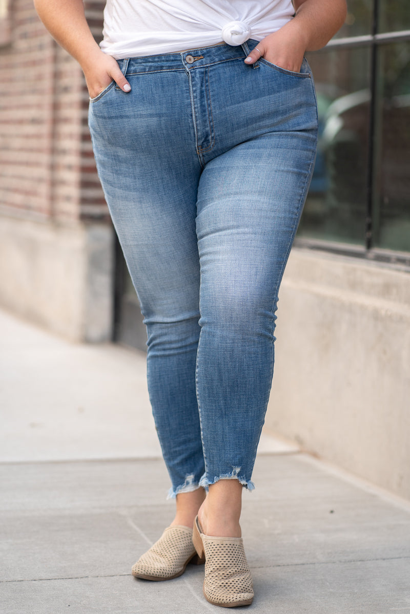 KanCan Jeans  Collection: Core Style Color: Medium Wash Cut: Ankle Skinny, 27" Inseam Rise: High-Rise, 9.5" Front Rise COTTON 91.9% POLYESTER 7% SPANDEX 1.1% Fly: Zipper  Style #: KC7274M Contact us for any additional measurements or sizing.  Victoria is wearing a size 2XL in these jeans.