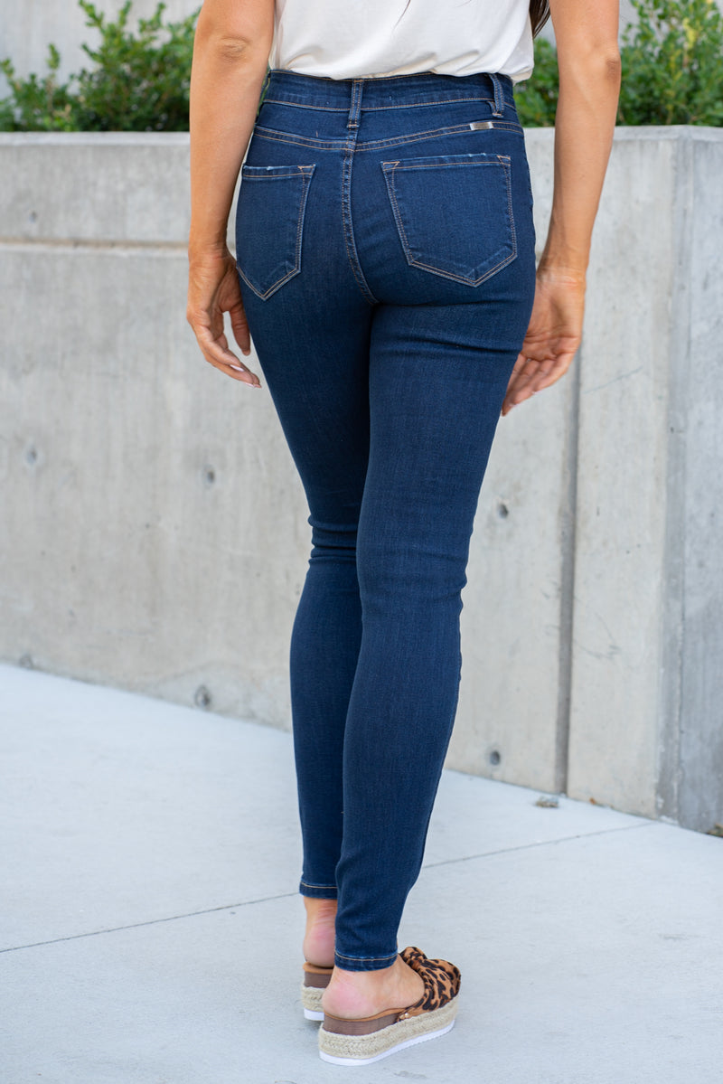 KanCan Jeans  Collection: Fall 2019 Style Name: Indigo Color: Dark Wash Cut: Skinny, 30.5" Inseam Rise: High-Rise, 9.5" Front Rise 64% Cotton 24% Polyester 10% Rayon 2% Spandex Fly: Exposed Button Fly  Style #: KC7301D