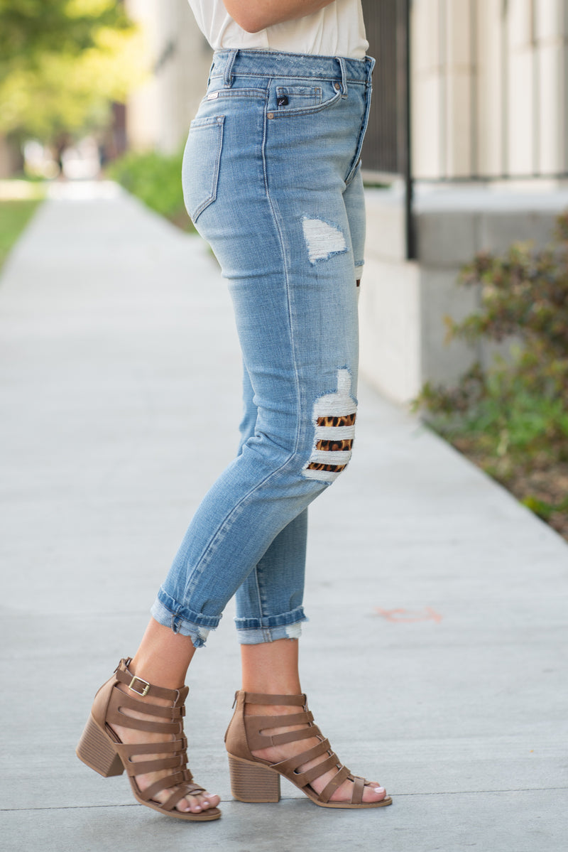 KanCan Jeans Collection: Fall 2020 Color: Medium Wash Ankle Skinny, 27" Inseam  High Rise, 10" Front Rise Leopard Patch Backed Distress  COTTON 99% SPANDEX 1% Fly: Zipper Style #: KC7131M Contact us for any additional measurements or sizing.  Chloe is 5’8" and 130 pounds. She wears a size 3 in jeans, a small top and 8.5 in shoes. She is wearing a 26/3 in these jeans.