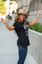 Zutter  This top spoke to you, now tell everyone else. You are a cowgirl at heart.  Collection: Fall 2020 Color: Black Neckline: Round Sleeve: Short Material: 50% Modal 50% Cotton Style #: F425-0139 Contact us for any additional measurements or sizing.  Taylor is 5'7" and wears a size 3 in jeans, small top and an 8.5 in shoes. She is wearing a size small in this tee.