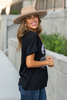 Zutter  This top spoke to you, now tell everyone else. You are a cowgirl at heart.  Collection: Fall 2020 Color: Black Neckline: Round Sleeve: Short Material: 50% Modal 50% Cotton Style #: F425-0139 Contact us for any additional measurements or sizing.  Taylor is 5'7" and wears a size 3 in jeans, small top and an 8.5 in shoes. She is wearing a size small in this tee.