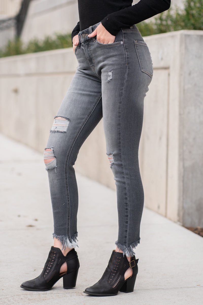 KanCan Jeans Collection: Winter 2020 Color: Dark Grey Cut: Skinny, 27" Inseam Rise: High-Rise, 9" Front Rise COTTON 94.2% POLYESTER 4.7% SPANDEX 1.1% Stitching: Classic Fly: Zipper Style #: KC7148BK Contact us for any additional measurements or sizing.  Melissa is 5'5" and wears a 24 in jeans, small top and size 6 shoe. She is wearing a 24 in these jeans.