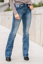 Miss Me Collection: Fall 2020 Wash: Dark Wash Inseam: 34" Inseam Material:  Sequin Trim and Rhinestone Rivets  Mid Rise, 8.75" Front Rise Embellished Horseshoe Pocket  Style #: M3694B Contact us for any additional measurements or sizing.  Taylor is 5'7" and wears a size 4 in jeans, small top and an 8.5 in shoes. She is wearing a size 26 in these jeans.