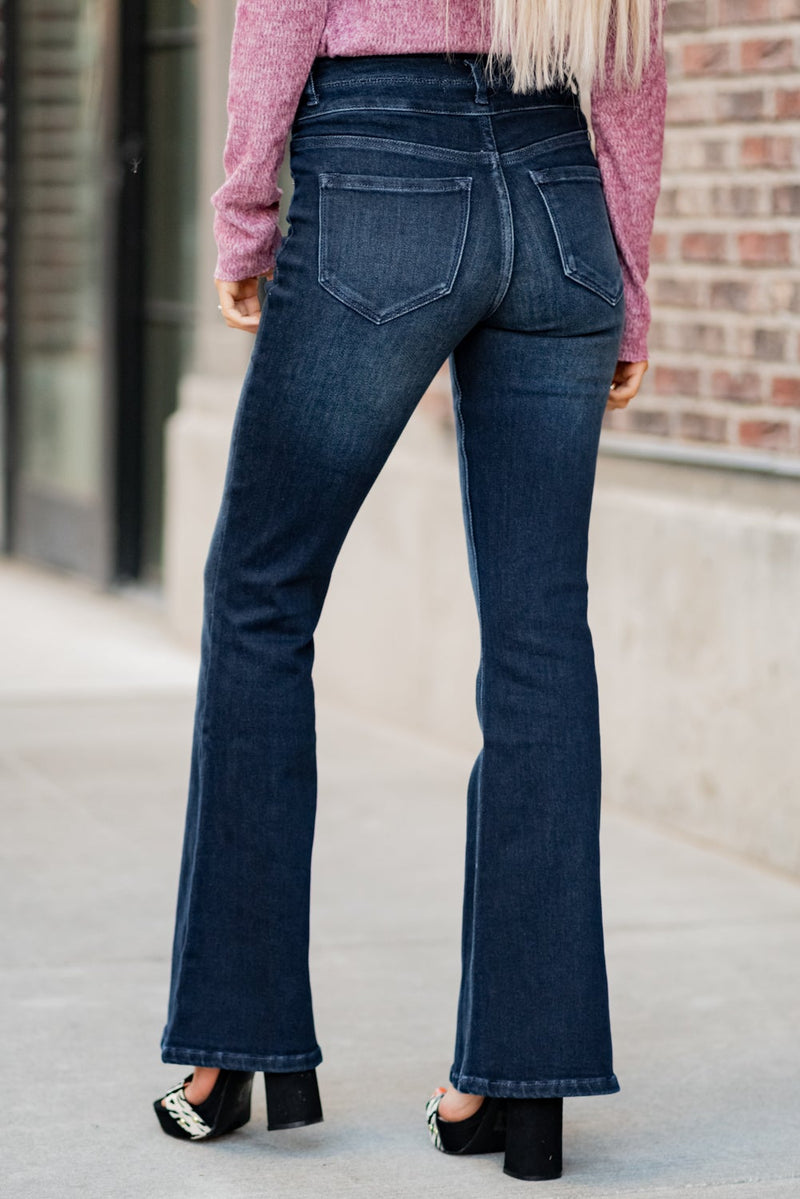 KanCan Jeans  Collection: Fall 2020  Color: Dark Wash Cut: Flare Cut, 34" Inseam Rise: High-Rise, 10.5" Front Rise Material: 94% Cotton 4% Polyester2% Spandex Detail: Whisker Wash Fly: Zipper Fly with Double Button Closure Style #: KC7123D Contact us for any additional measurements or sizing.  Haley is 5’6" and wears size 3 in jeans, a small top and 7.5 in shoes. She is wearing a 25 in these jeans.