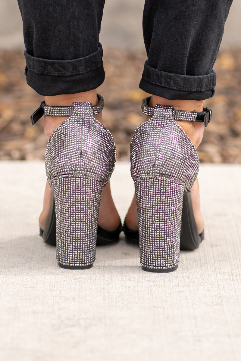 Glitter Strappy Heels by Qupid Style Name: Prenton Color: Black Cut: Zipper Back Sandals Material. Outsole: Rubber Upper: Textile/Manmade  Contact us for any additional measurements or sizing.